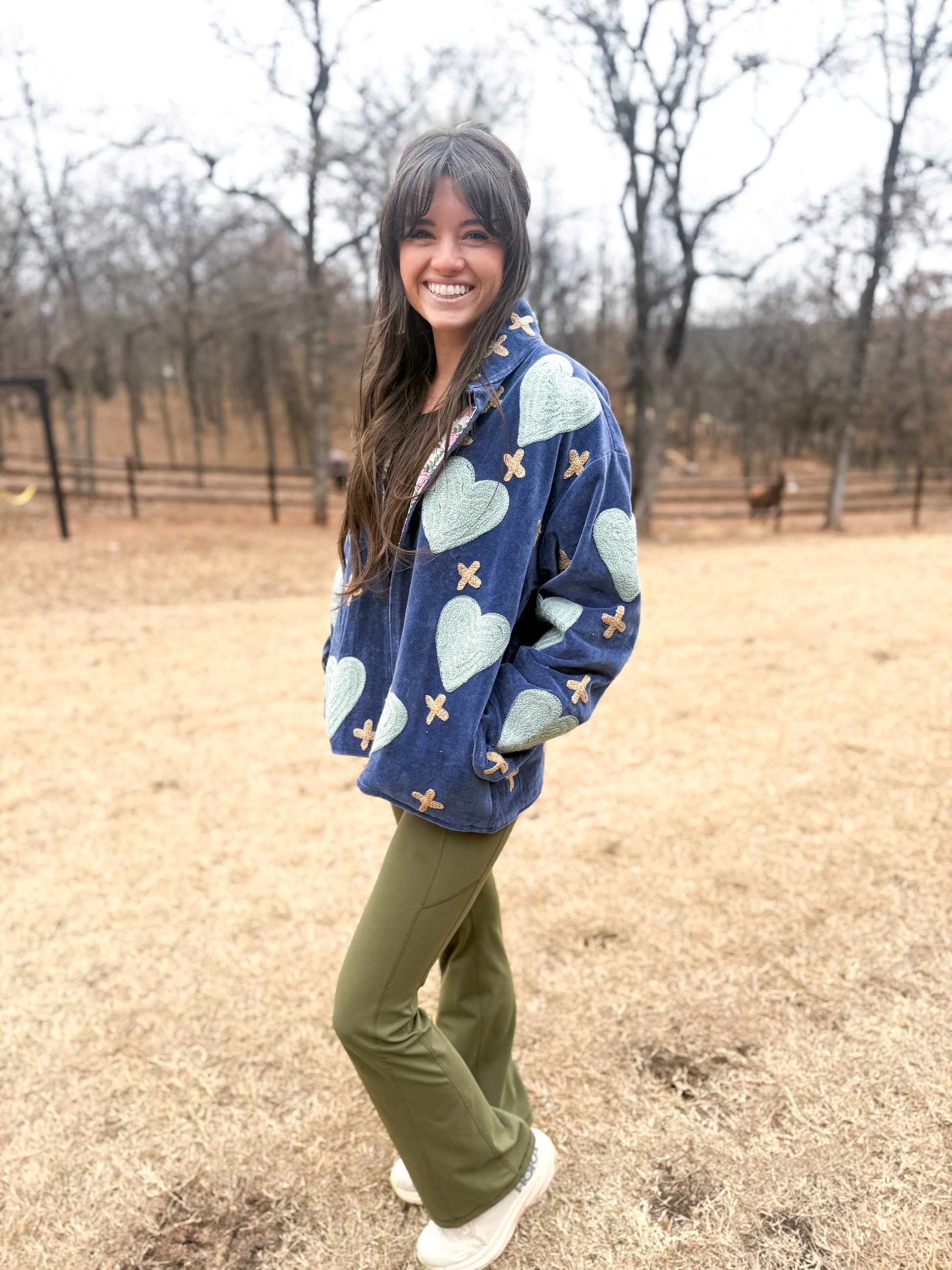Blue velvet jacket with teal hearts and tan Swiss crosses